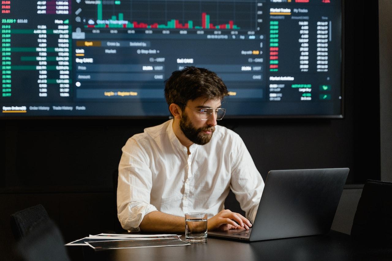 man on laptop with data